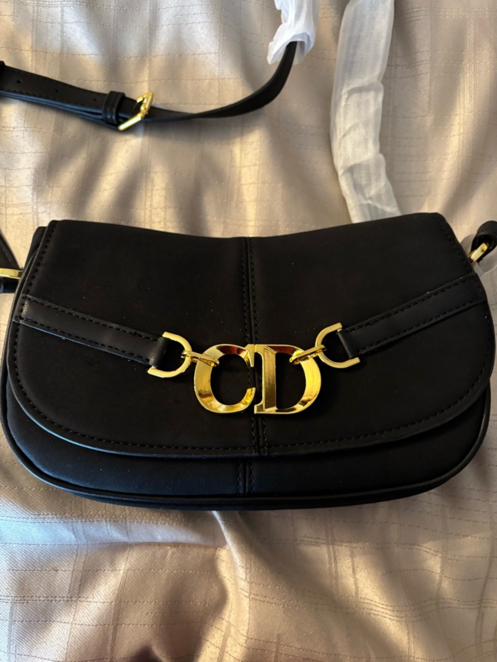Black handbag with Gold Emblem